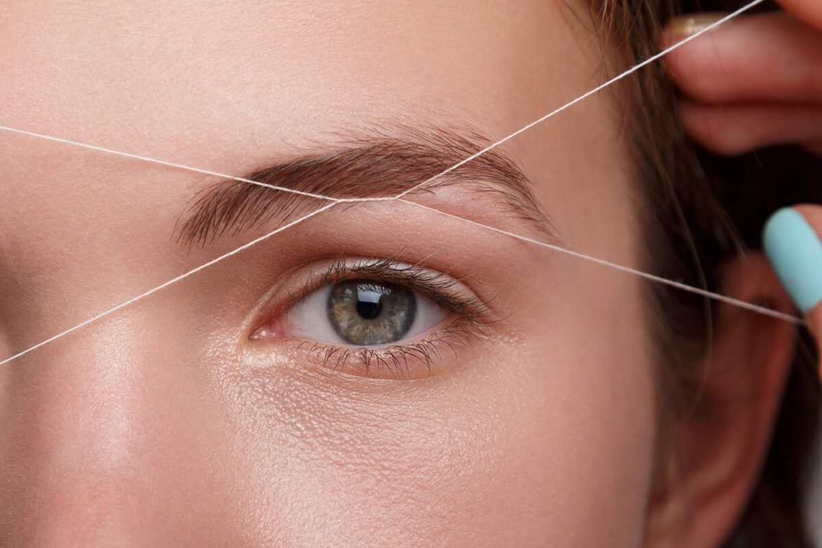 Close up eyebrow threading treatment in East Grinstead